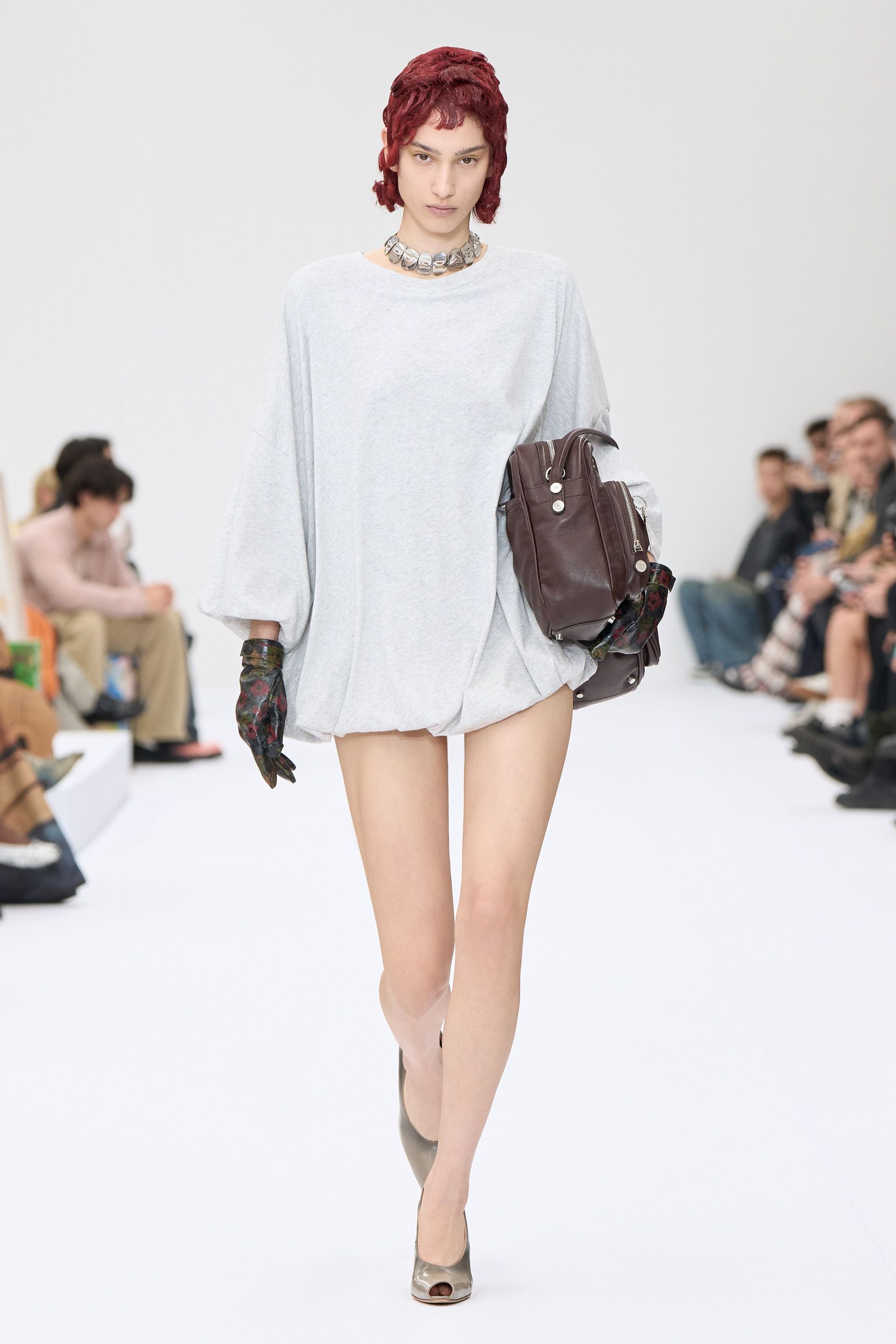 Model walking the Acne Studios SS25 runway
