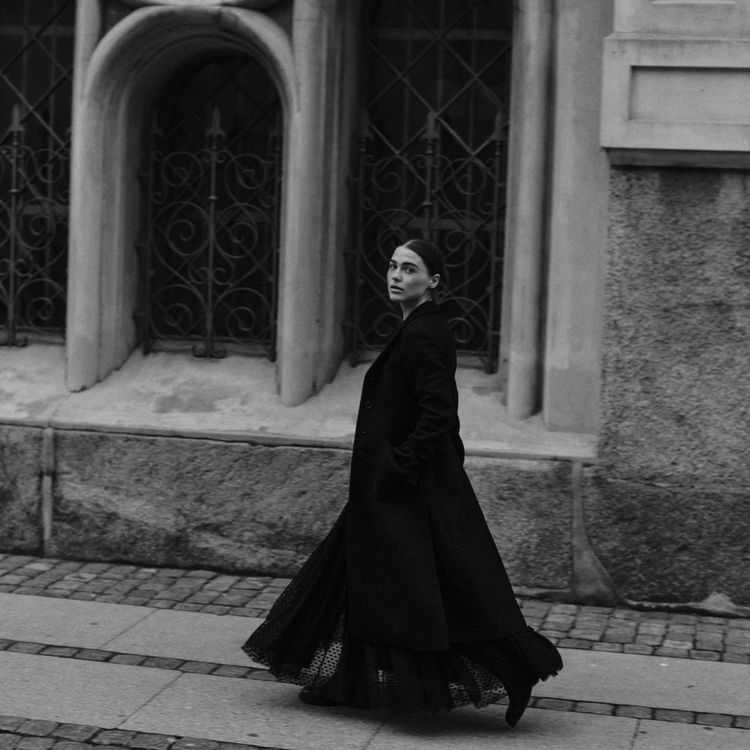 Sophia Roe in long black coat