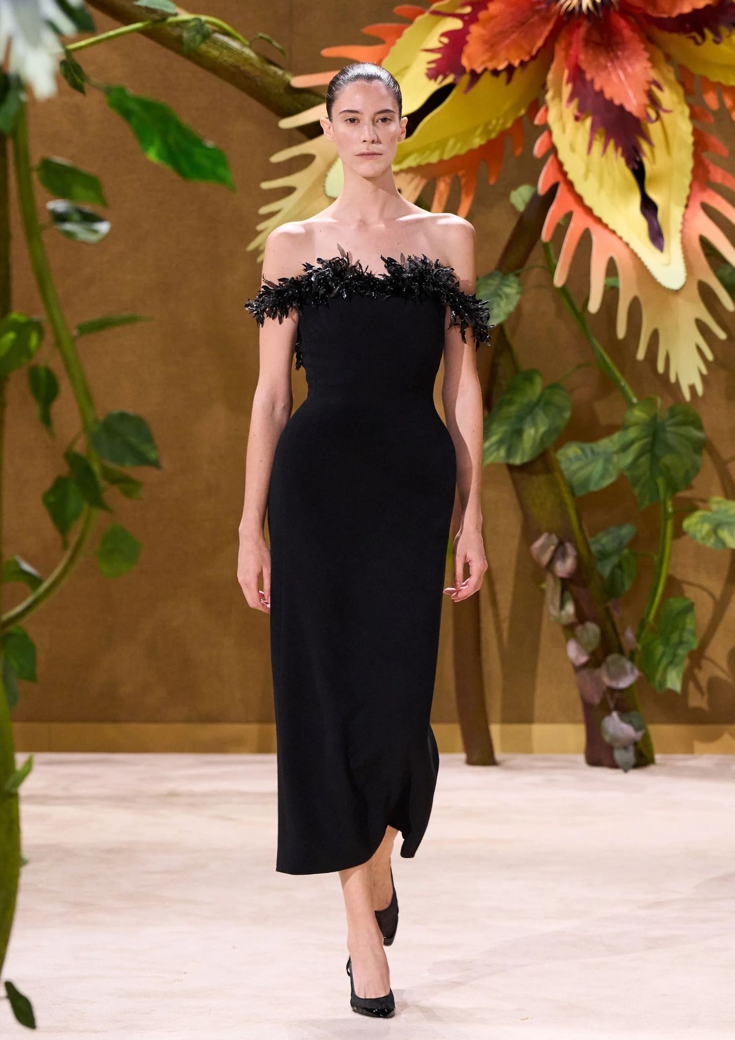 Off shoulder black dress with feathers
