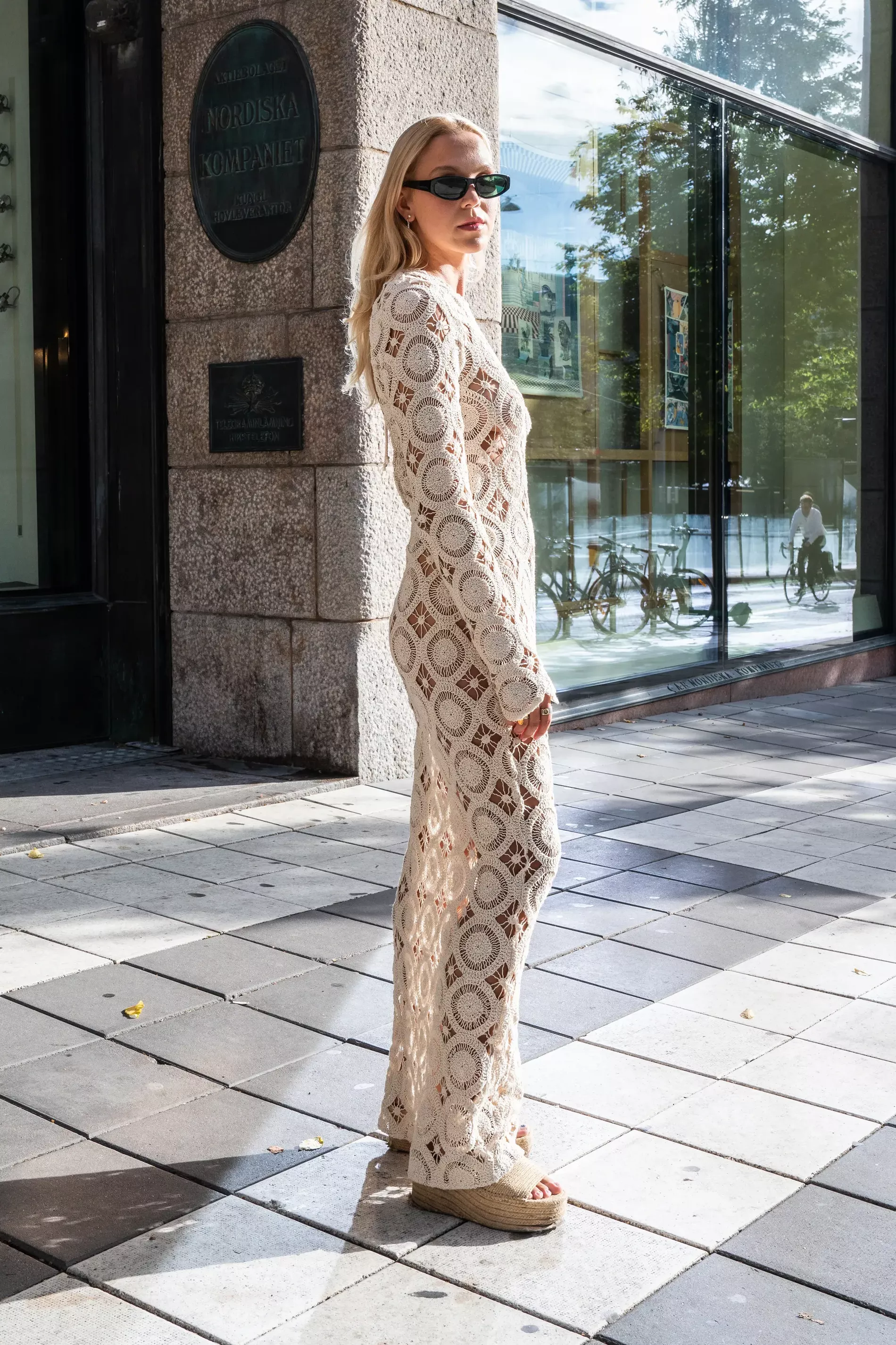 Stockholm fashion week guest wears crochet long sleeve dress 