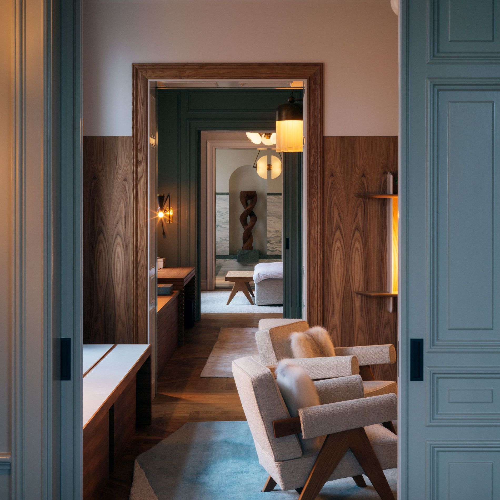 A spacious apartment rendered in white, blue and wood