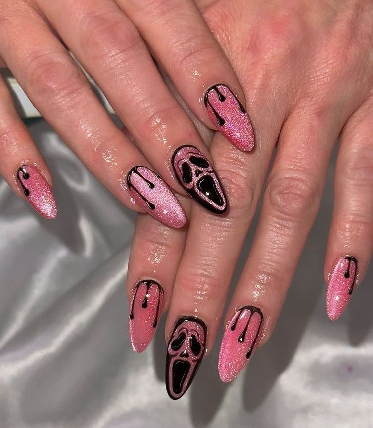 Pink and black Halloween nail design