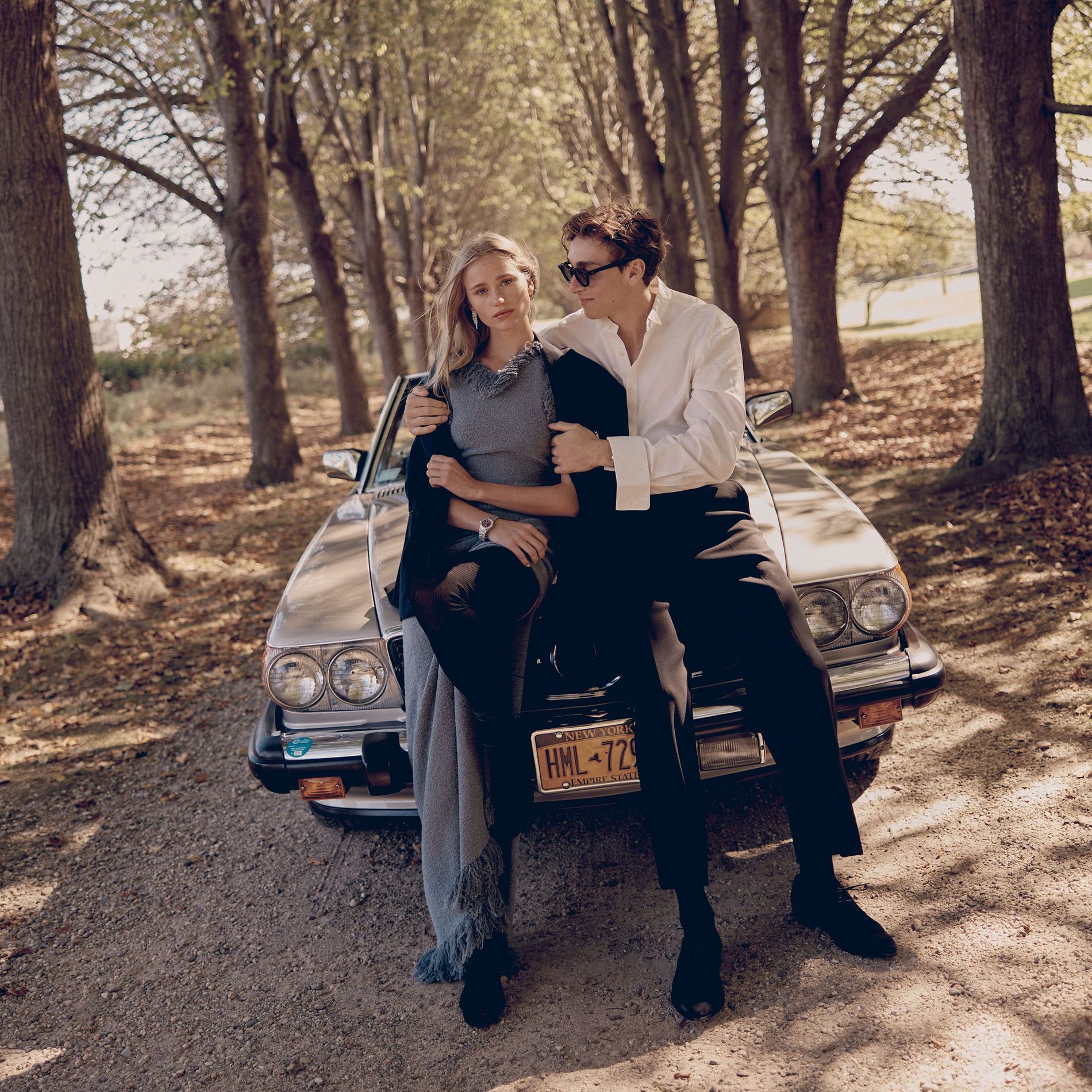 Stylish young couple embracing on a sunny fall day 