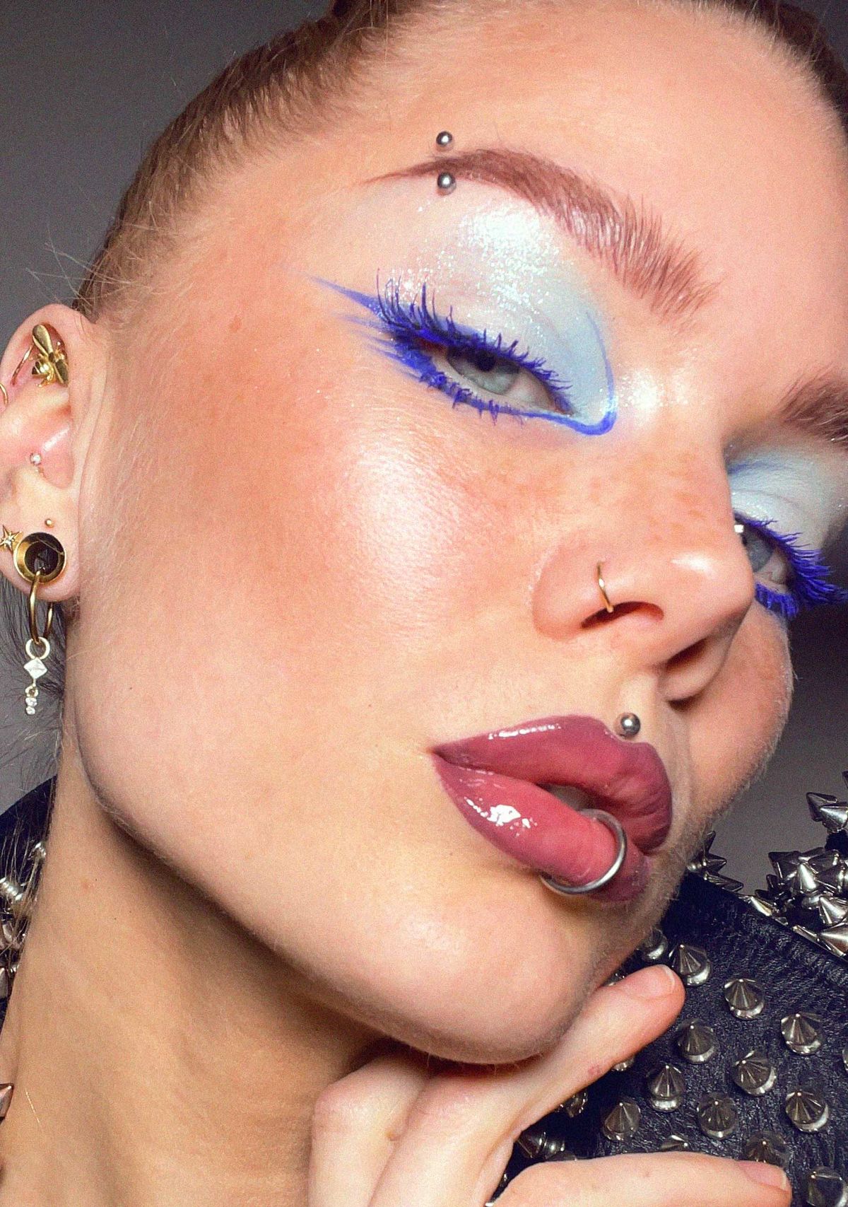 Linda Hallberg wears blue mascara accentuated by a matching blue eyeliner wing 