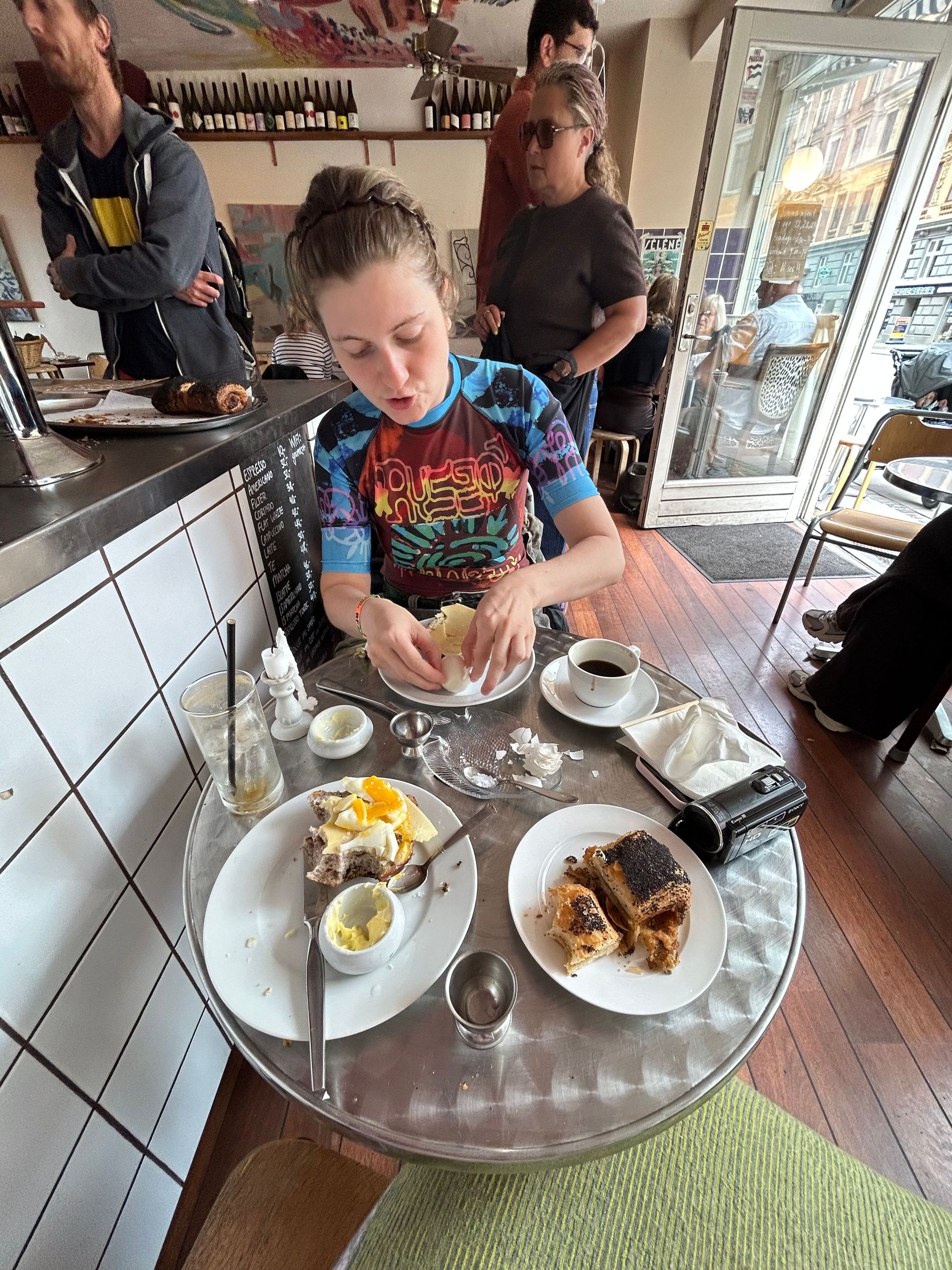 Walnut bread served with butter, cheese, jam, and a boiled egg at Grums in Nørrebro, Copenhagen
