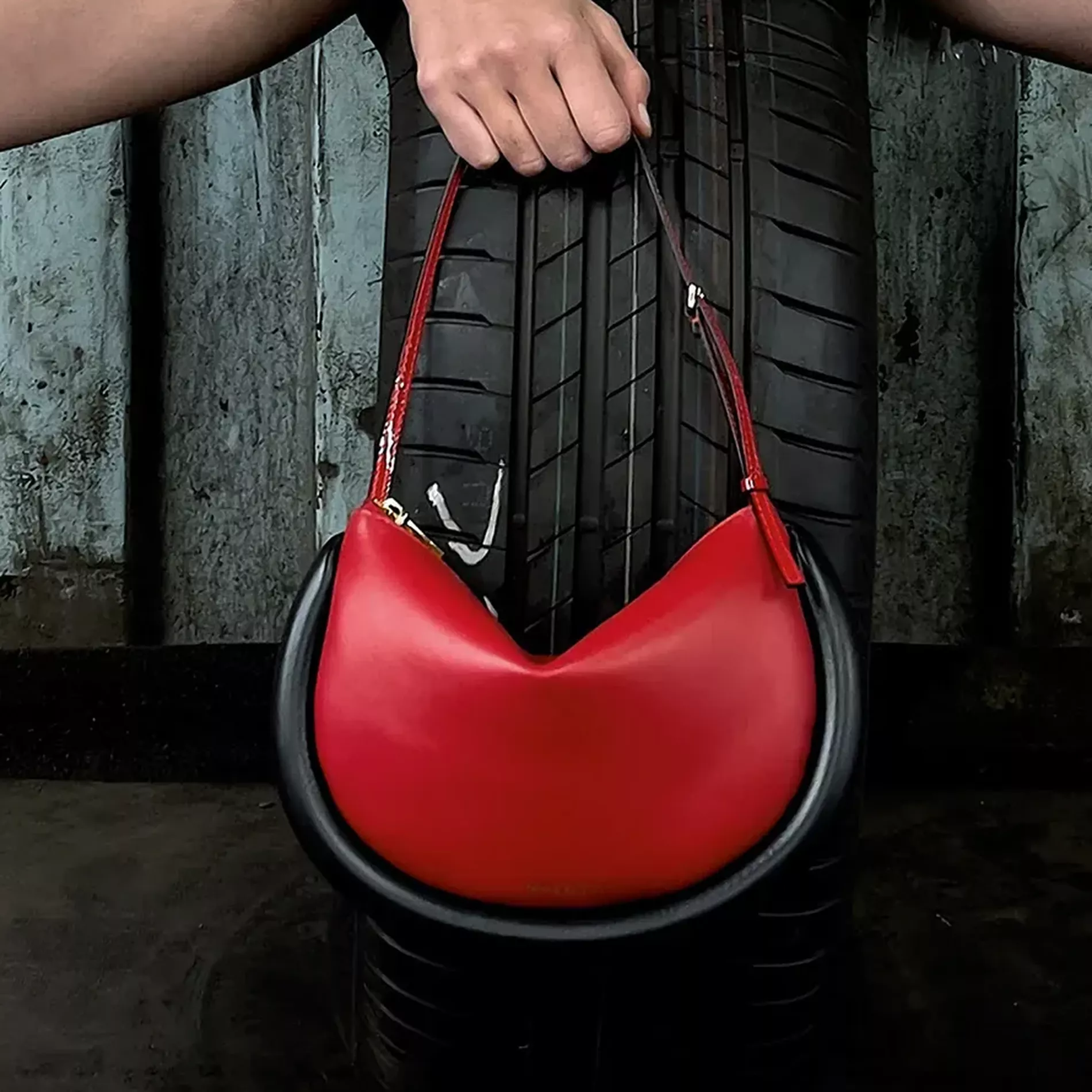 Red 'bumper' bag by JW Anderson