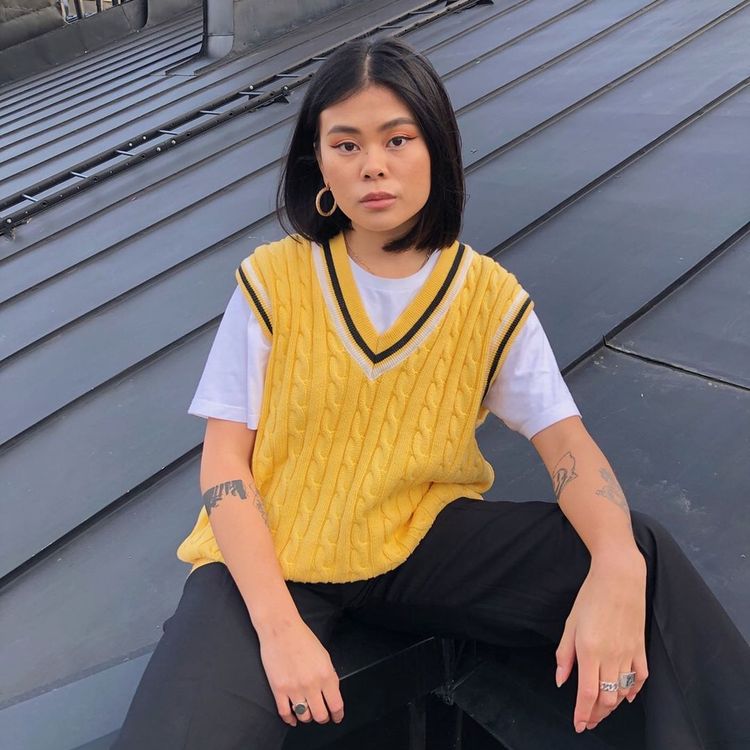 Julia Dang in yellow sweater vest