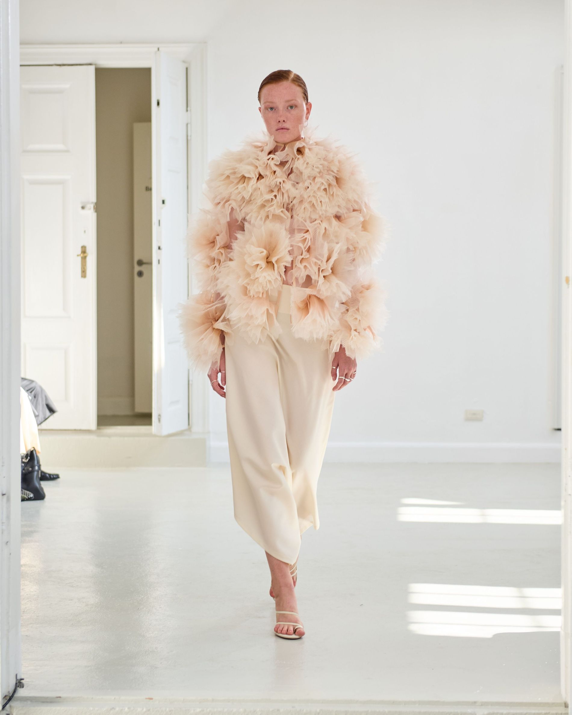White textured ruffled jacket with white pants