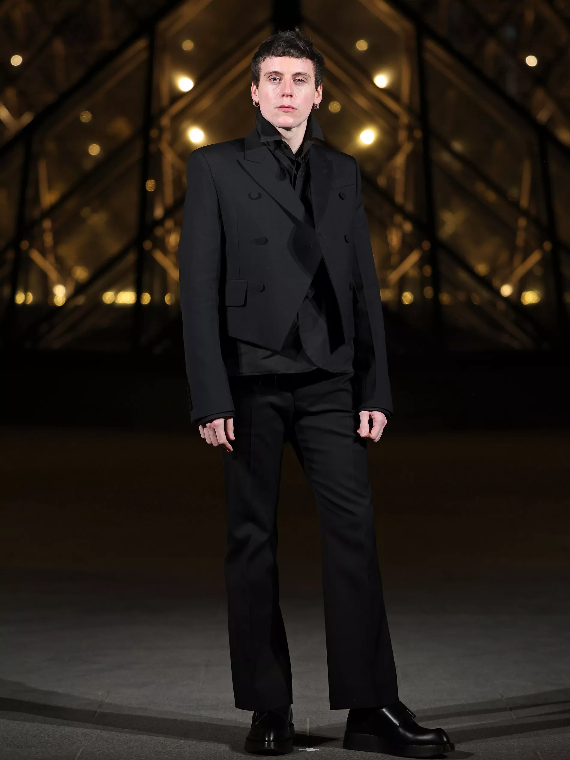 Sean McGirr former creative director of Alexander McQueen  stands outside of the Louvre, during a dinner in Paris