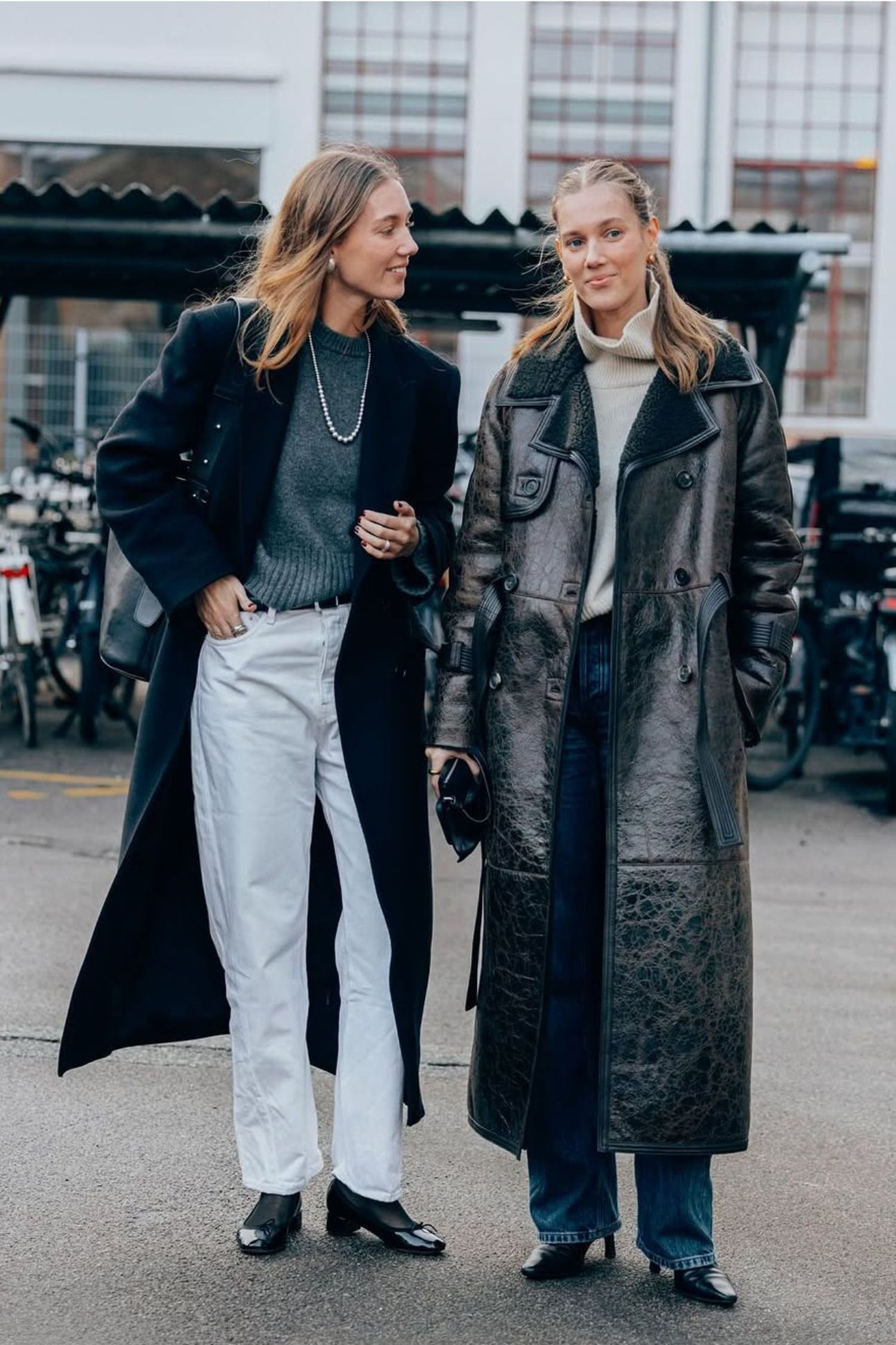 Cecilie and Amalie Moosgaard attends Copenhagen fashion week wearing long shearling and wool coats and jeans 