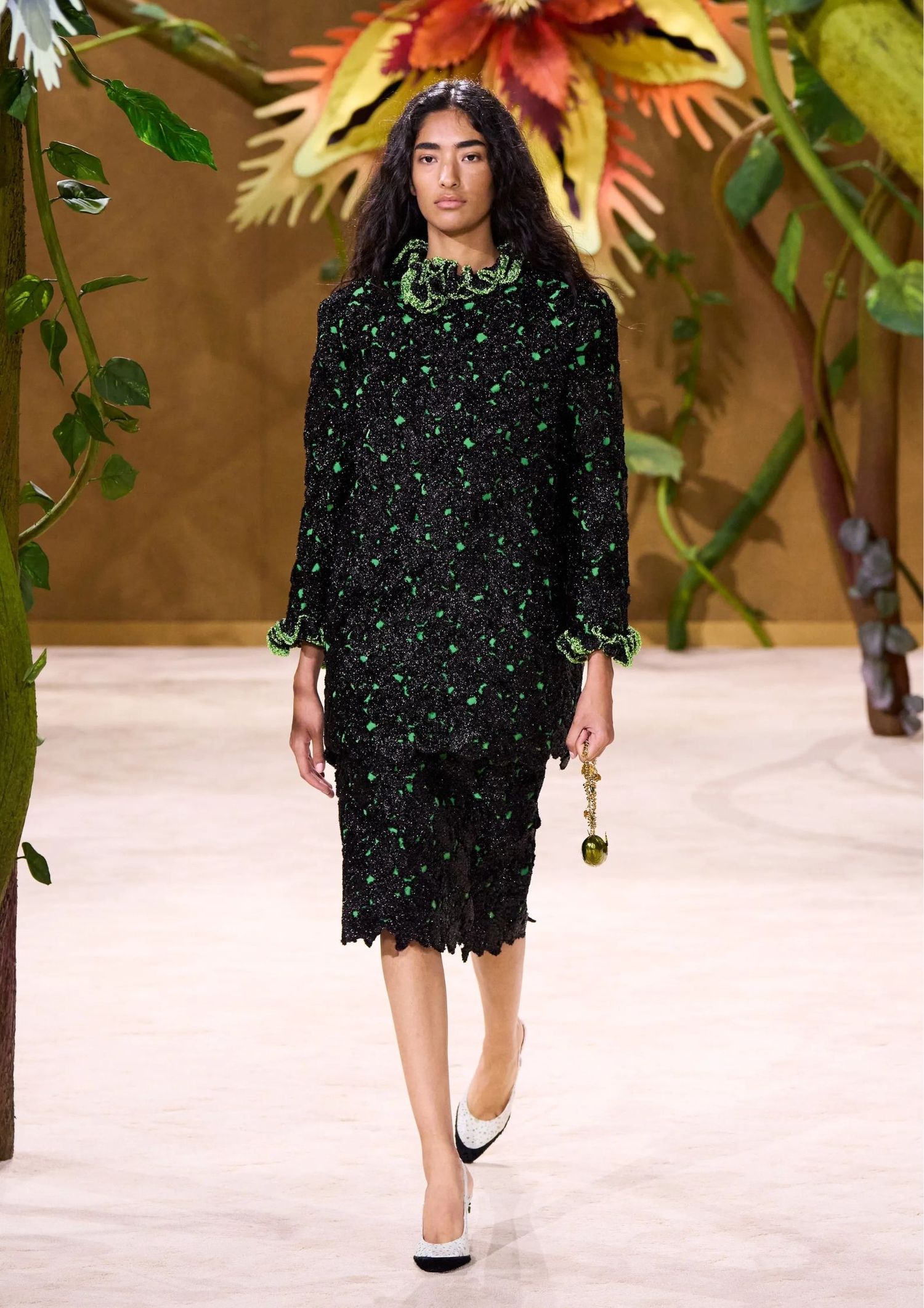 Black long-sleeved textured dress with green embellishments