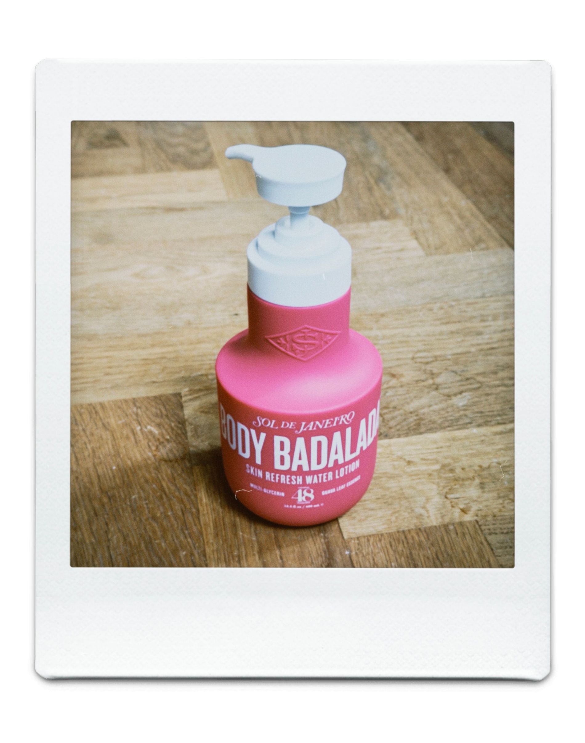 A pink bottle with white top