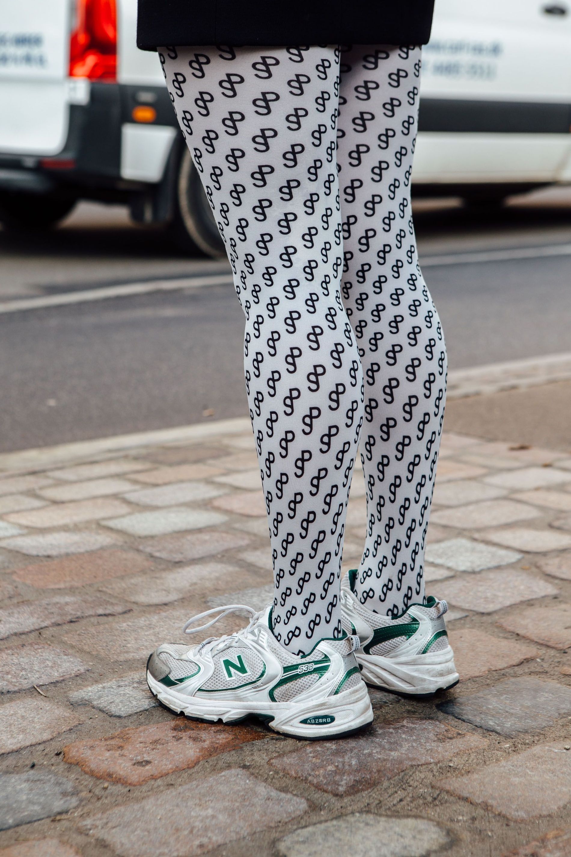 A guest wears New Balance sneakers at Copenhagen Fashion Week AW23