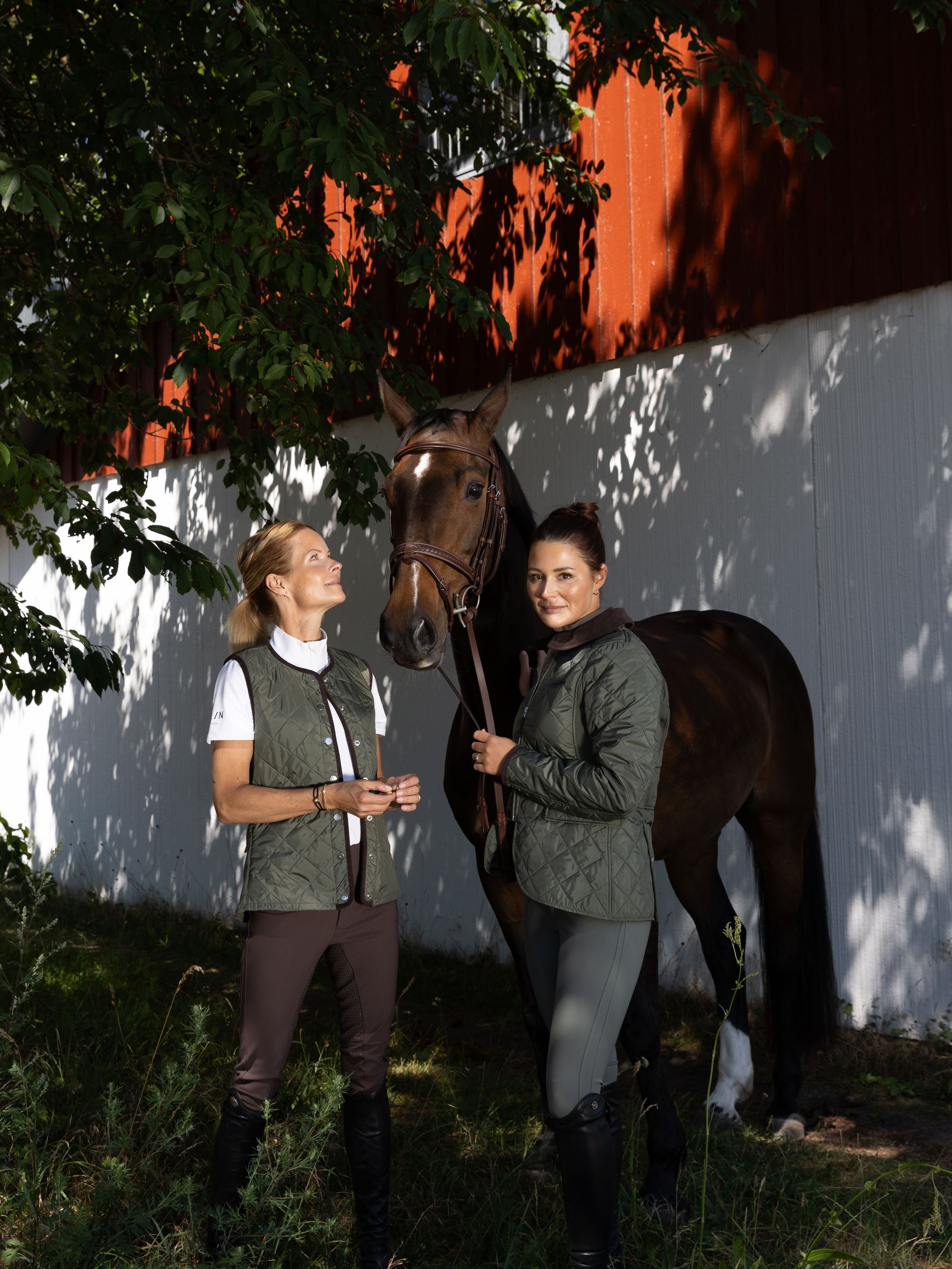 Malin Bayard & Nicole Holmen pose with a horse at Flasterbo horse show wearing All In Equestrian