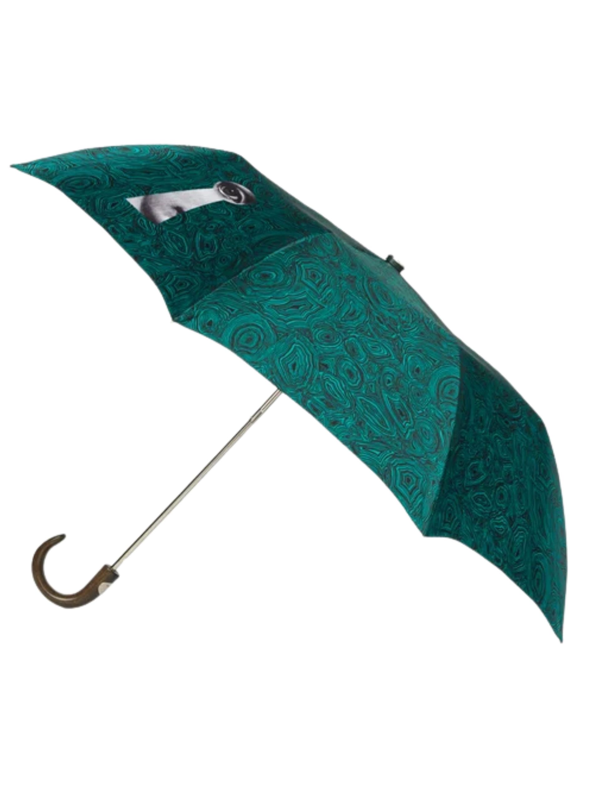 Green swirl umbrella with key and eye detail against a white background