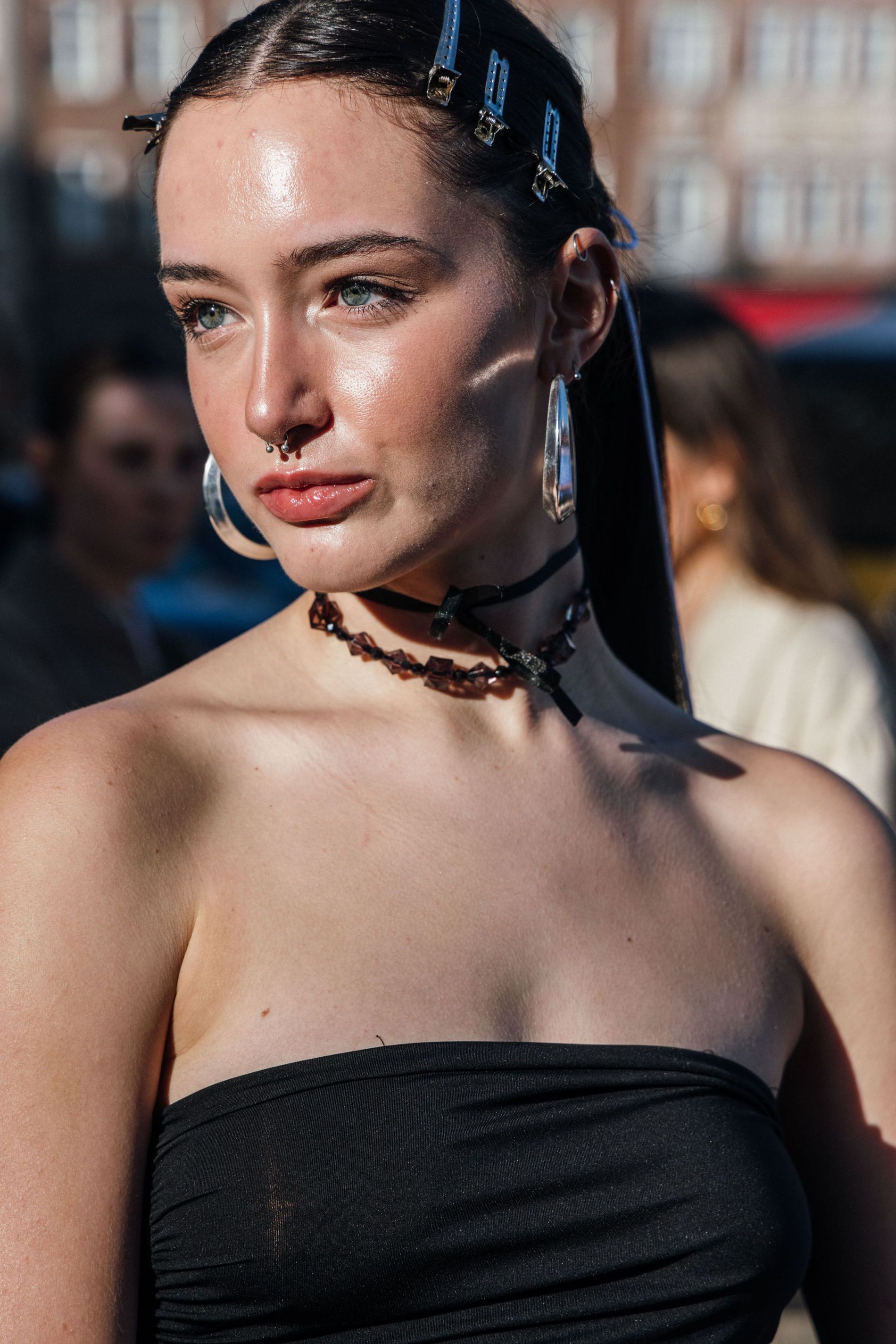 Guest wears a pair of silver statement earrings to Copenhagen Fashion Week SS24